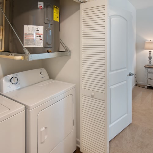 A full-sized washer and dryer in an apartment at Cottages at Emerald Cove in Savannah, Georgia