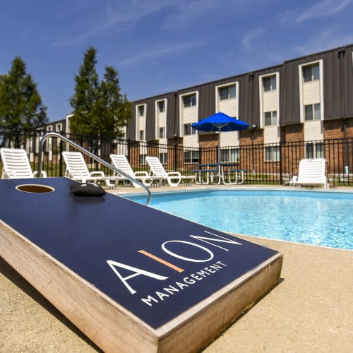 Resident dipping their legs in the pool at Reserves at Arlington in Columbus, Ohio