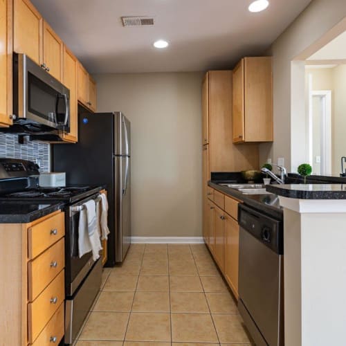 A kitchen with appliances in a home at Atkins Circle Apartments & Townhomes in Charlotte, North Carolina