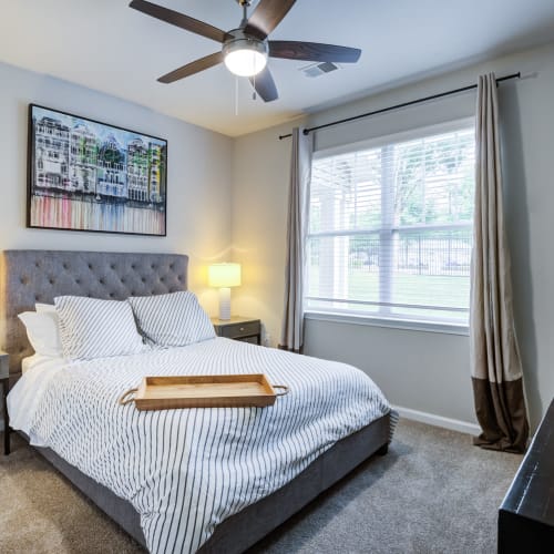 A ceiling fan in a furnished apartment bedroom at North Hills at Town Center in Raleigh, North Carolina