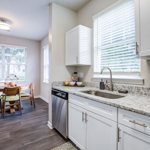 An apartment kitchen and dining room at North Hills at Town Center in Raleigh, North Carolina