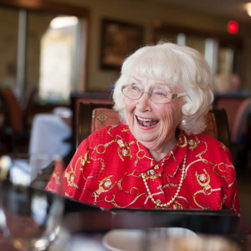 Resident smiling and laughing at Oxford Springs Tulsa Assisted Living in Tulsa, Oklahoma