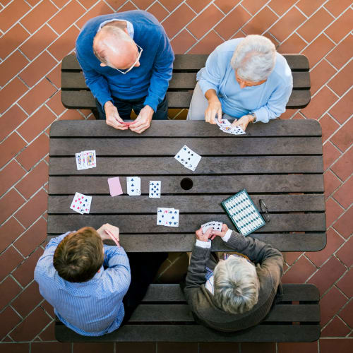 Residents playing cards at Oxford Springs Edmond in Edmond, Oklahoma