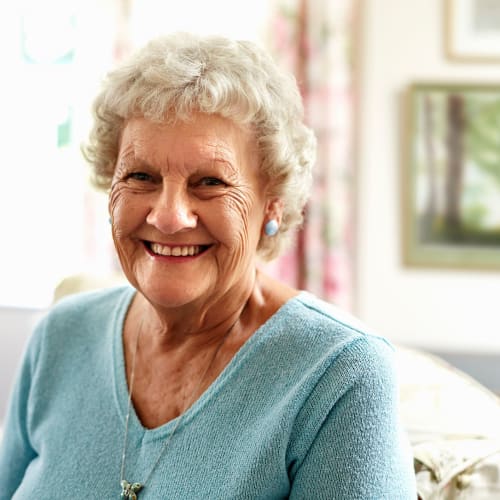 Smiling resident looking at the camera at Oxford Springs Tulsa Assisted Living in Tulsa, Oklahoma