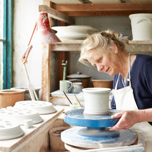Woman making pottery at Oxford Springs Edmond in Edmond, Oklahoma