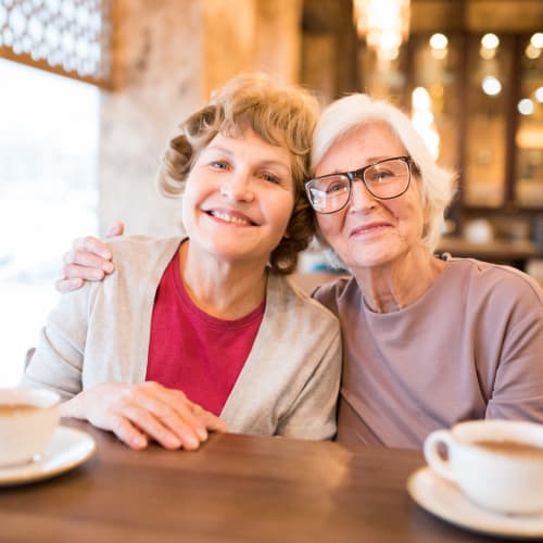 Two residents drinking coffee at Oxford Springs Tulsa Memory Care in Tulsa, Oklahoma