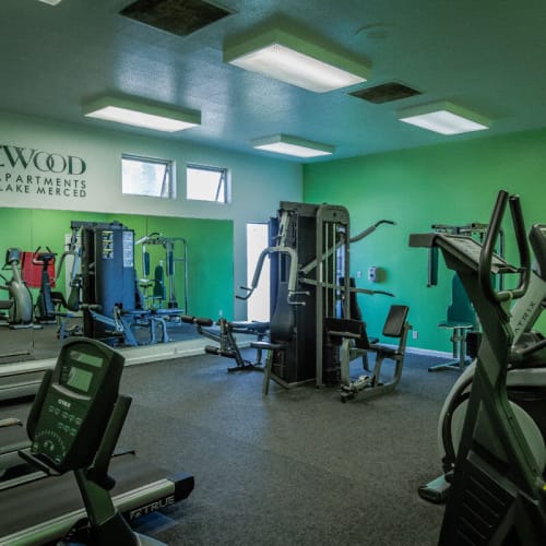 Modern gym fitness room equipment at Lakewood Apartments at Lake Merced in San Francisco, California