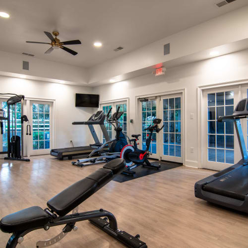 Fitness center with treadmills at Houston Lake Apartments in Kathleen, Georgia