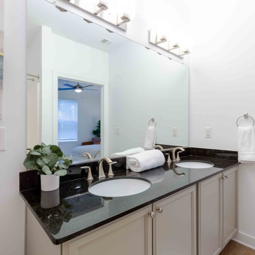 Bathroom with double vanity at Spring Water Apartments in Virginia Beach, Virginia