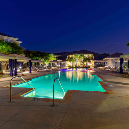 Swimming pool with lights at Spring Water Apartments in Virginia Beach, Virginia