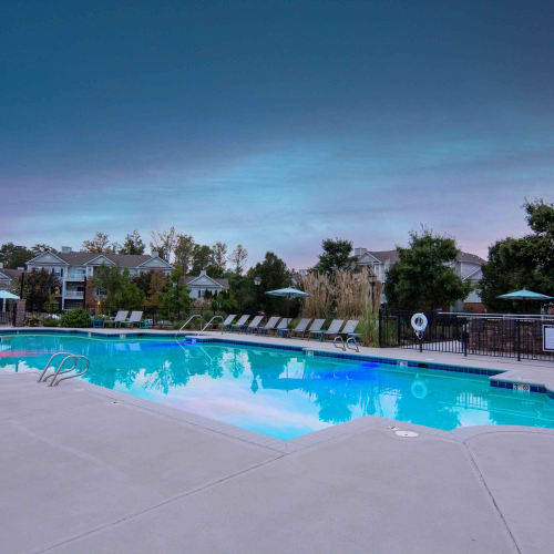 Swimming pool with poolside seating at River Forest in Chester, Virginia