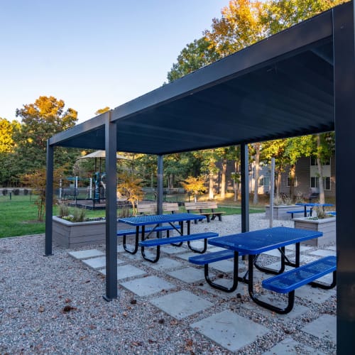 Outdoor tables under a canopy at The Point at Beaufont in Richmond, Virginia