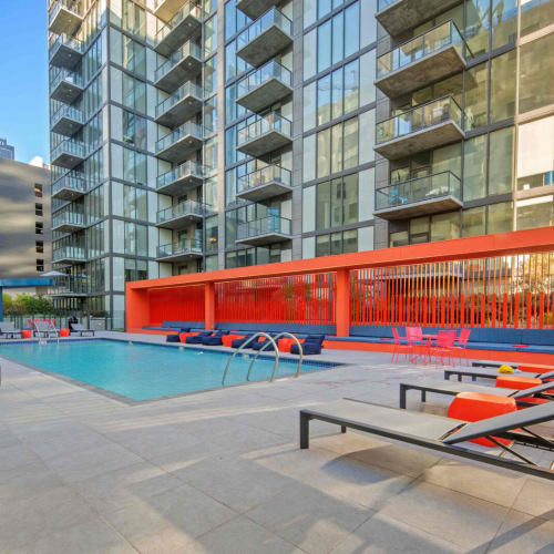 Community pool with lounge chairs at Josephine DTLA in Los Angeles, California