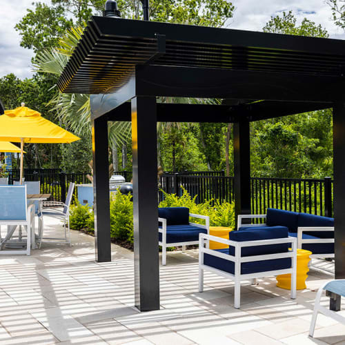 Seating under a poolside cabana at Integra Trails in Cocoa, Florida