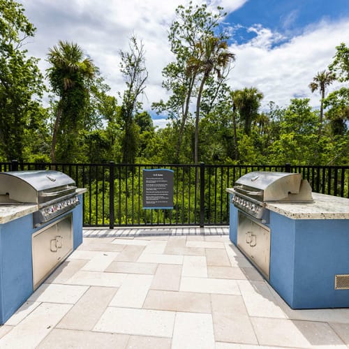 Two grilling stations for residents next to the swimming pool at Integra Trails in Cocoa, Florida