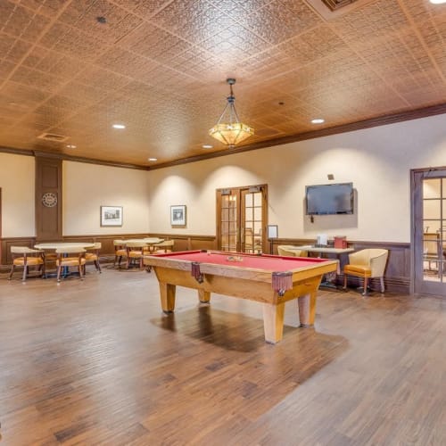 Resident game room with pool table at Oxford Vista Wichita in Wichita, Kansas