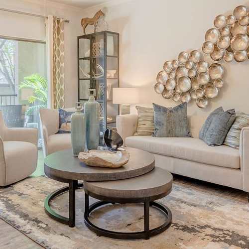 Spacious living room with premium furniture and wood-style flooring at Wildwood Creek in Grapevine,Texas