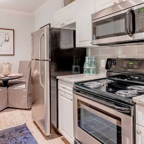 Classy apartment with stainless-steel appliances including refrigerator at Wildwood Creek in Grapevine,Texas