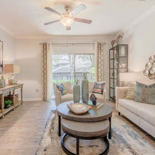 Bright living room with access to private patio at Wildwood Creek in Grapevine,Texas