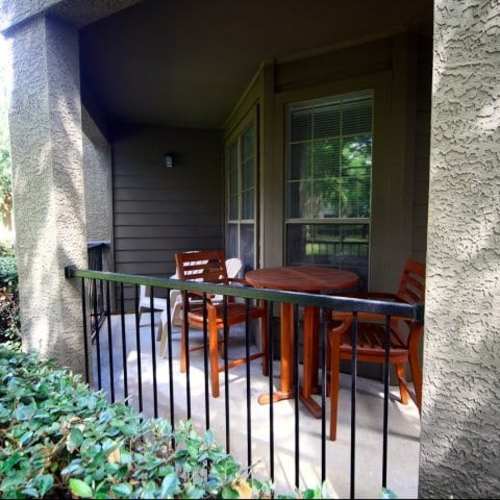 Private patio with wooden chairs at Wildwood Creek in Grapevine,Texas