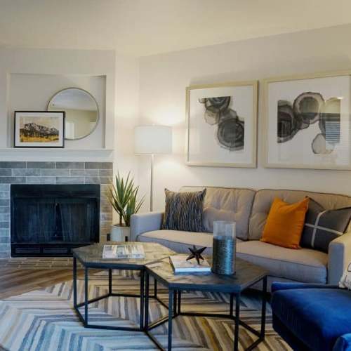 Living with couch and fireplace at GrandView @ Flatirons in Louisville, Colorado