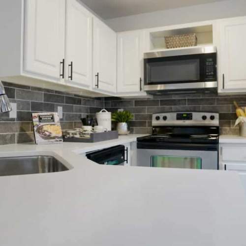 Kitchen with backsplash at GrandView @ Flatirons in Louisville, Colorado