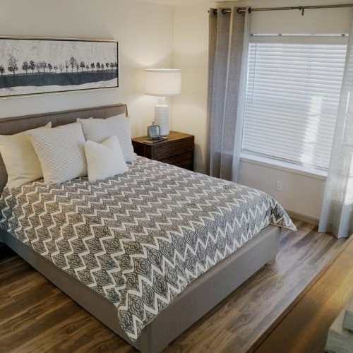 Spacious bedroom with hardwood flooring at GrandView @ Flatirons in Louisville, Colorado