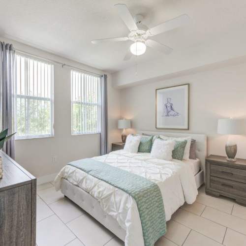 Comfortable bedroom with a cozy bed at The Olivia in Homestead, Florida