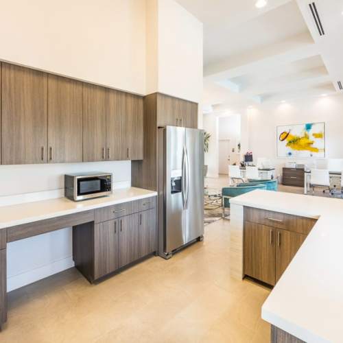 Apartment kitchen with appliances and countertops at The Olivia in Homestead, Florida
