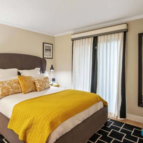 Comfortable bedroom with a cozy bed at Ludlam Point in Miami, Florida