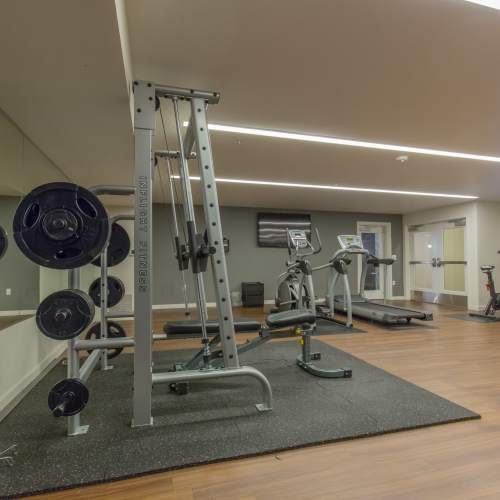 Fitness center with mirror and weights at Linden in Portland, Oregon