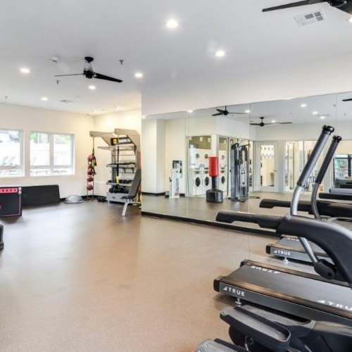 Fitness studio with ceiling fans and mirror at Sullivan's Ridge in Portland, Oregon