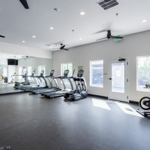 Fitness studio with ceiling fans and windows at Sullivan's Ridge in Portland, Oregon
