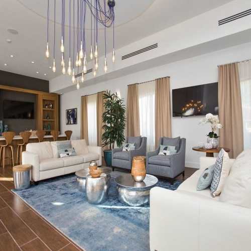 Clubhouse living room with couch, coffee table and more at Club Prado in West Miami, Florida