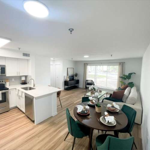 Dining room with close access to fully-equipped kitchen and living room at Emerald Grove in Orlando, Florida, 