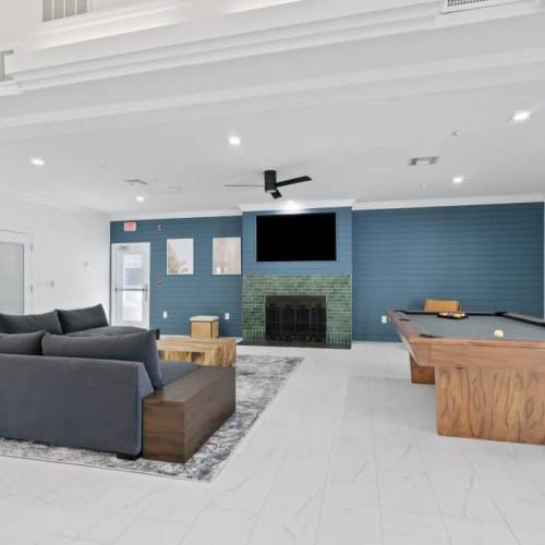Multifunction game room with shuffle board at Emerald Grove in Orlando, Florida, 