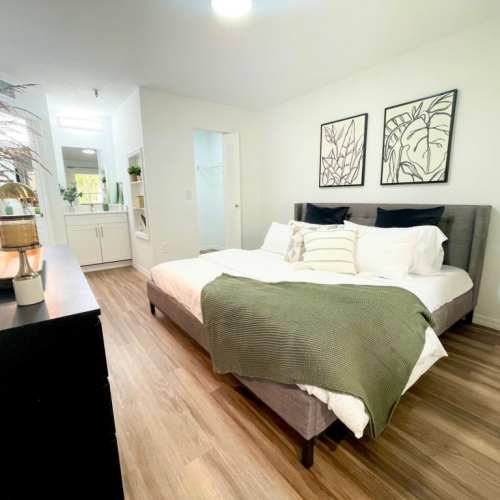 Bedroom with hard-wood style flooring at Emerald Grove in Orlando, Florida, 