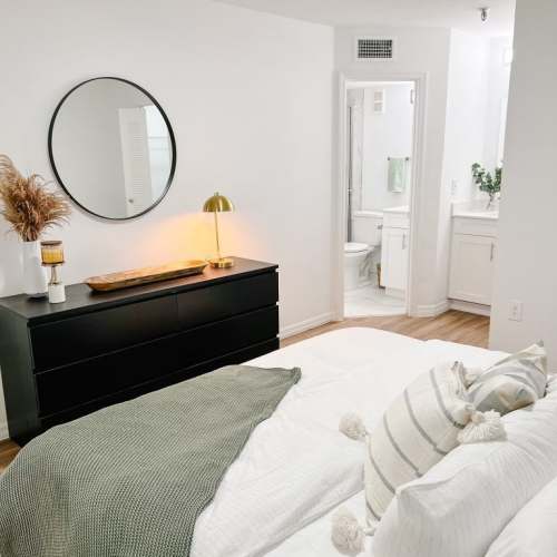 Well-lit bedroom with own bathroom at Emerald Grove in Orlando, Florida, 