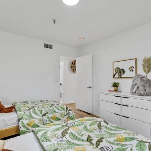 Well-lit and spacious bedroom at Emerald Grove in Orlando, Florida,  