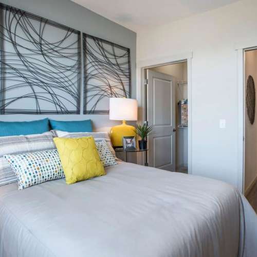 Bedroom with a comfortable bed and a attached bathroom at Elevation @ County Line Station in Englewood, Colorado