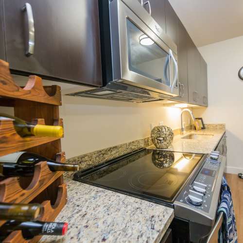 Kitchen with granite countertop at The Cameron in Portland, Oregon 