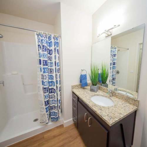 Bathroom with vanity mirror at The Cameron in Portland, Oregon