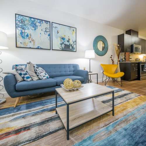 Living room with beautiful wall art at The Cameron in Portland, Oregon