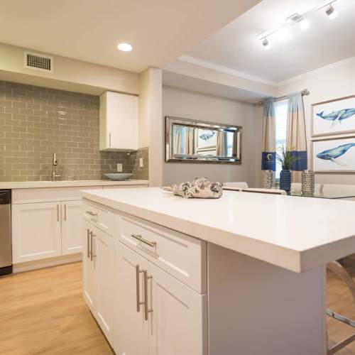 Spacious island kitchen, dishwasher, and sink at {location_name}} in Plantation, Florida