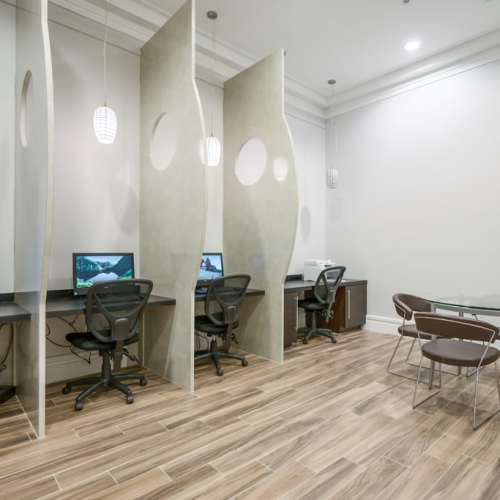Community work place with chairs and coffee table at {location_name}} in Plantation, Florida