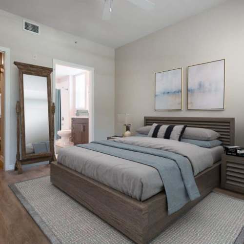 Spacious bedroom with large comfortable bed and ceiling fan at Solero at Plantation in Plantation, Florida