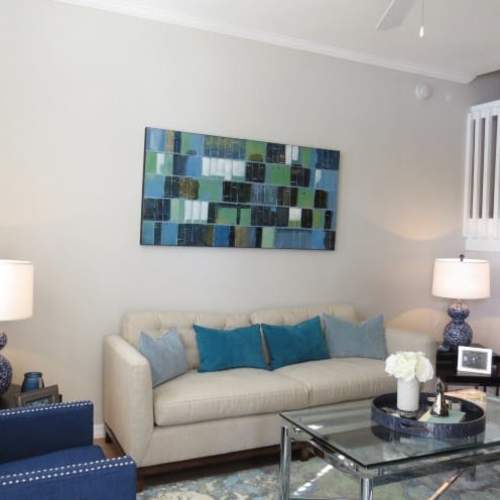Living room with comfortable couch, staircase leading to the other floor at {location_name}} in Plantation, Florida