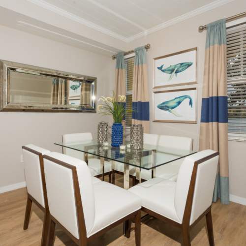 Dining table with chairs at {location_name}} in Plantation, Florida
