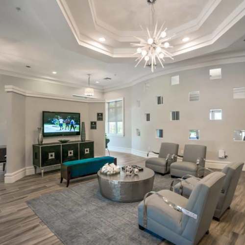Spacious clubhouse with lots of seating and large windows at {location_name}} in Plantation, Florida