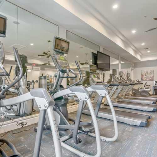 Resident running on treadmill at {location_name}} in Plantation, Florida